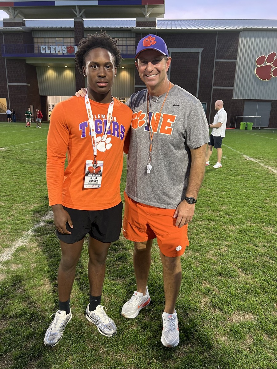 Nick Gordon on a recruiting visit to Clemson, wearing a Clemson Tigers shirt and visitor credential